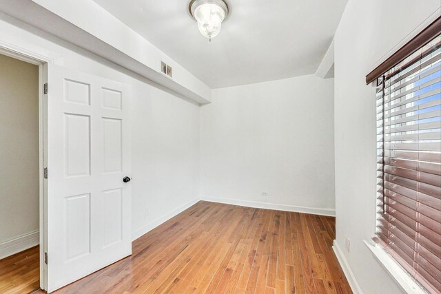 4364 S Oakenwald Ave, Chicago, IL 60653 - empty room featuring hardwood / wood-style floors, baseboards, and visible vents