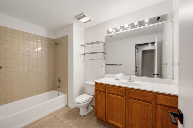 full bathroom featuring toilet, vanity,  shower combination, tile patterned flooring, and visible vents