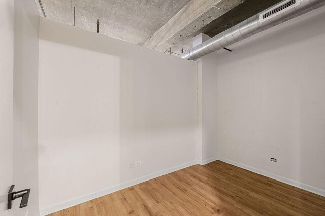 walk in closet featuring visible vents and wood finished floors