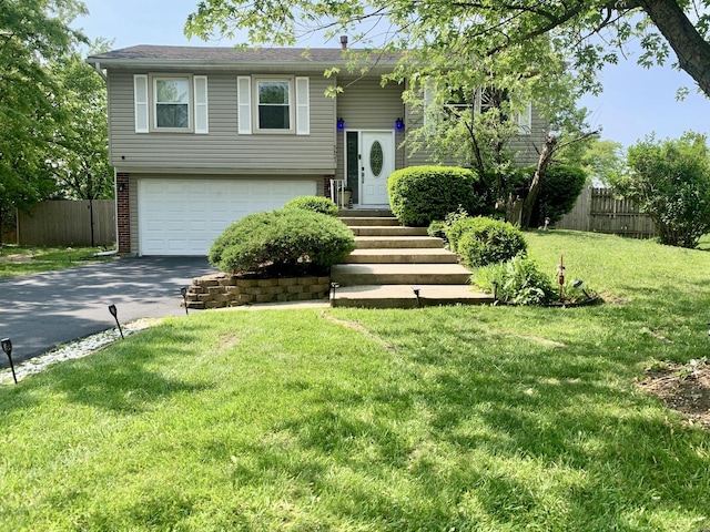 5621 Fernwood Ct, Matteson, IL 60443 - split foyer home with an attached garage and asphalt driveway