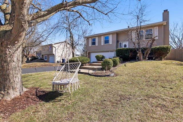 5621 Fernwood Ct, Matteson, IL 60443 - view of front of property with a chimney, an attached garage, driveway, and a front lawn