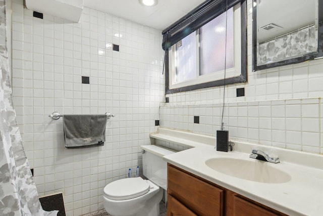5621 Fernwood Ct, Matteson, IL 60443 - bathroom featuring tile walls, vanity, and toilet