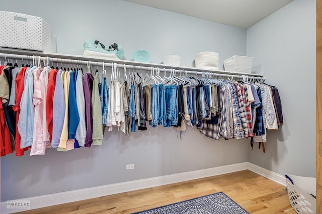 spacious closet featuring wood finished floors