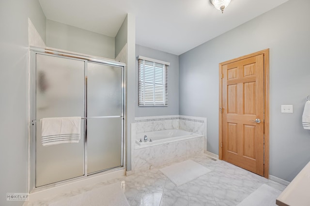 full bath featuring marble finish floor, a garden tub, and a shower stall