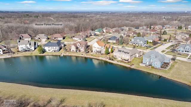 birds eye view of property featuring a residential view and a water view