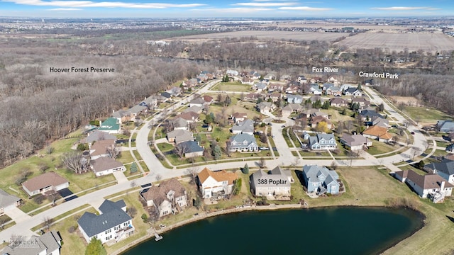 bird's eye view featuring a residential view and a water view