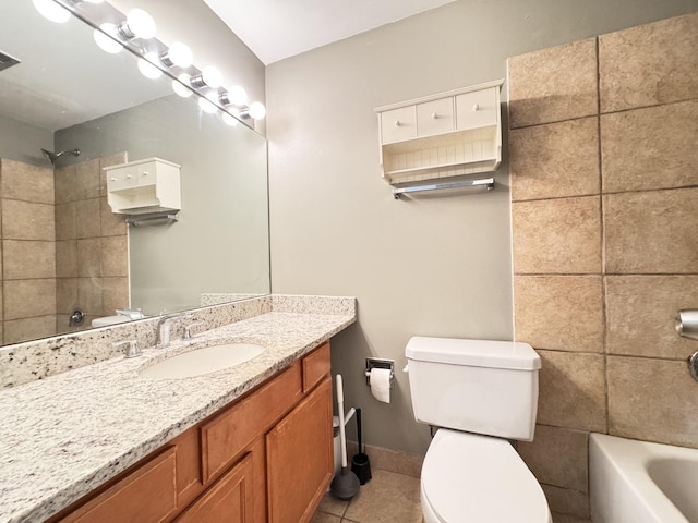full bath with baseboards, toilet,  shower combination, vanity, and tile patterned floors