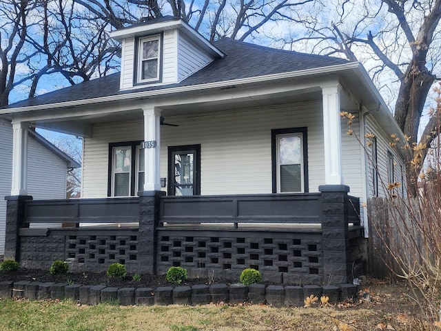 view of front of house with a porch and a shingled roof
