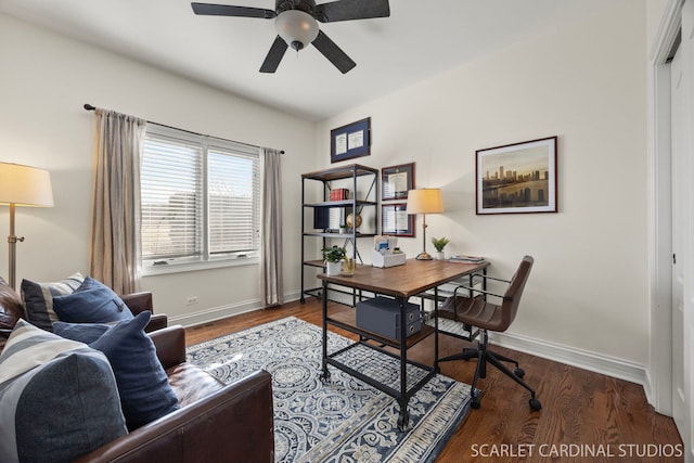 office space featuring wood finished floors, baseboards, and ceiling fan