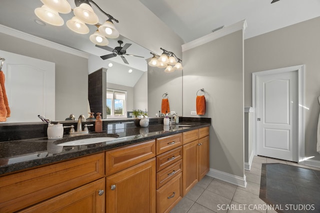 full bath featuring double vanity, ceiling fan, a sink, and tile patterned flooring