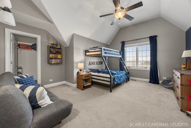 carpeted bedroom with baseboards, lofted ceiling, and ceiling fan