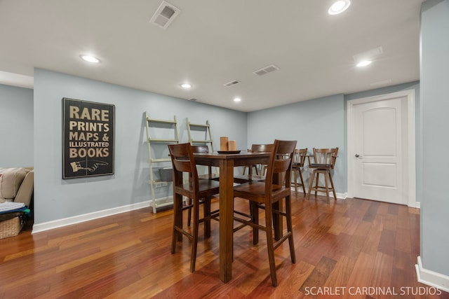 dining space with wood finished floors, recessed lighting, baseboards, and visible vents
