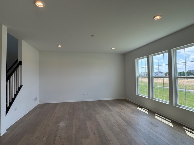 627 Henry Ln, Oswego, IL 60543 - unfurnished room featuring hardwood / wood-style flooring and recessed lighting