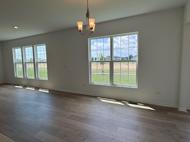 627 Henry Ln, Oswego, IL 60543 - unfurnished room with a chandelier, hardwood / wood-style flooring, and recessed lighting
