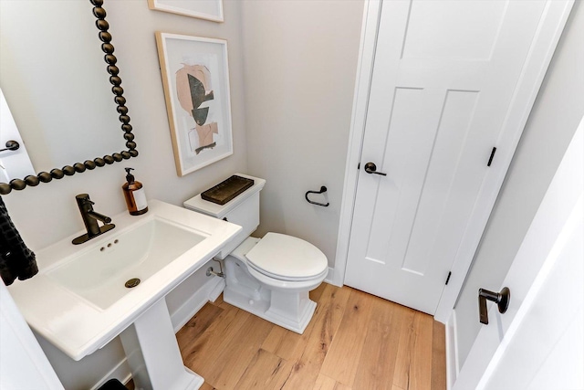 627 Henry Ln, Oswego, IL 60543 - bathroom with wood finished floors and toilet