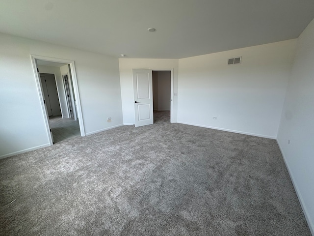 627 Henry Ln, Oswego, IL 60543 - unfurnished bedroom featuring carpet flooring and baseboards