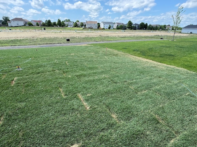 627 Henry Ln, Oswego, IL 60543 - view of green lawn featuring a residential view