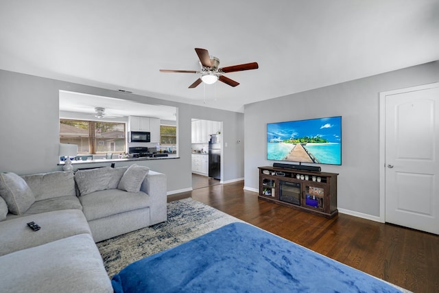 13000 W Playfield Dr, Crestwood, IL 60418 - living area featuring a ceiling fan, wood finished floors, and baseboards