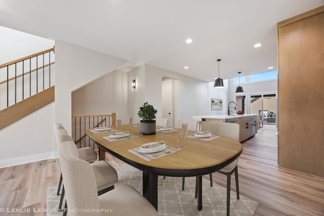 dining area featuring stairway, recessed lighting, and light wood-style flooring