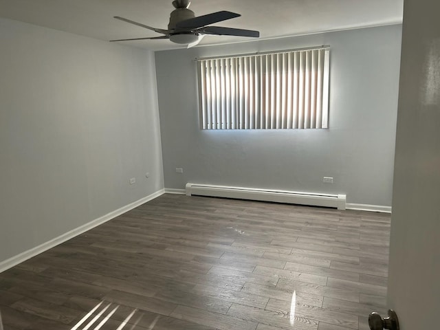 unfurnished room featuring baseboards, wood finished floors, a baseboard heating unit, and a ceiling fan