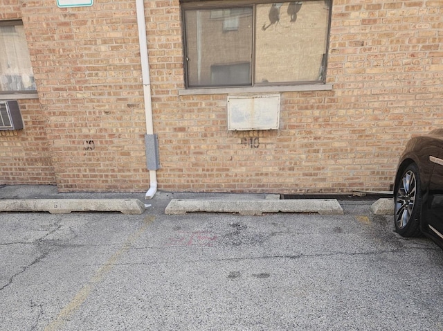 exterior space with brick siding