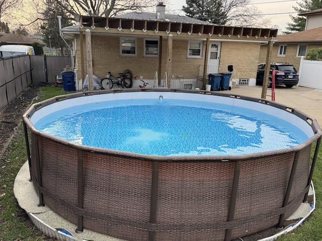 view of pool with a patio, fence, and a fenced in pool