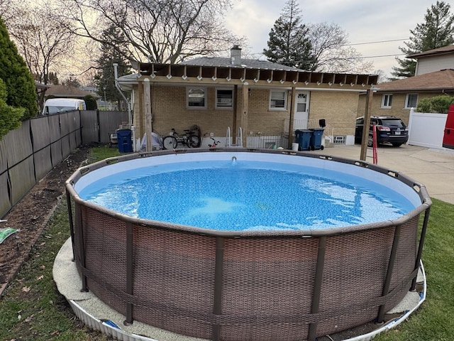 view of pool featuring a fenced in pool and fence