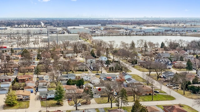 drone / aerial view featuring a residential view and a water view