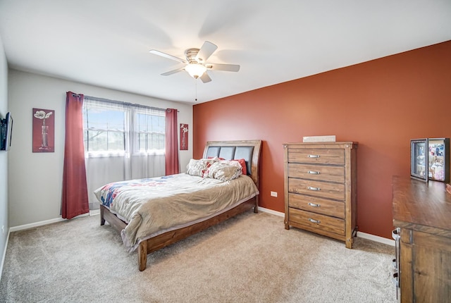 bedroom with baseboards, ceiling fan, and carpet flooring