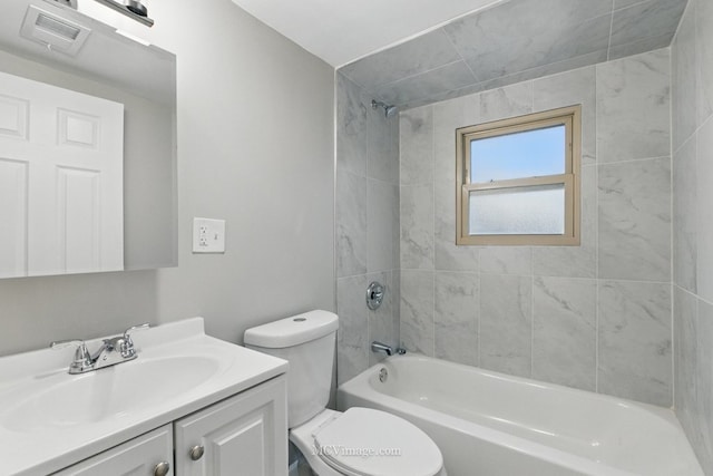 bathroom with toilet, visible vents, washtub / shower combination, and vanity