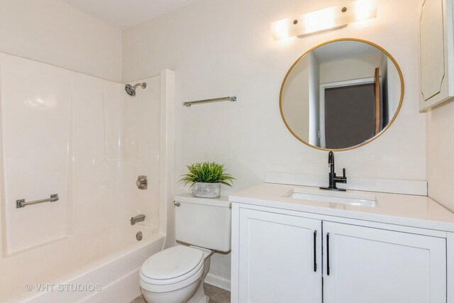 full bathroom with toilet, vanity, and shower / washtub combination