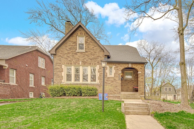 1739 Cedar Rd, Homewood, IL 60430 - english style home with a shingled roof, a chimney, a front lawn, and brick siding