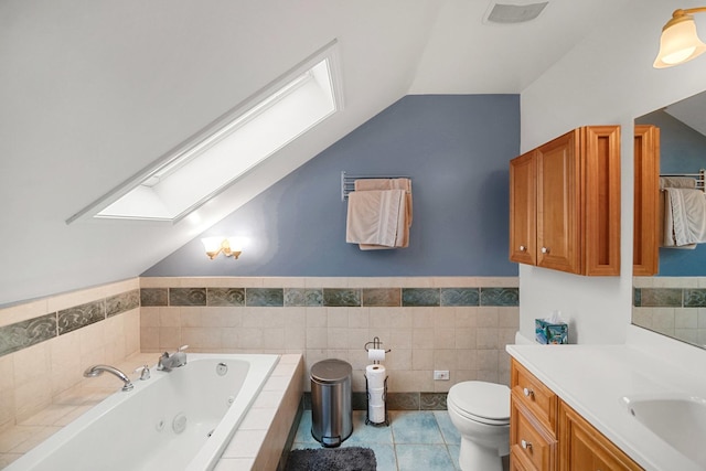 1739 Cedar Rd, Homewood, IL 60430 - full bathroom featuring vaulted ceiling with skylight, tile patterned flooring, vanity, a whirlpool tub, and toilet