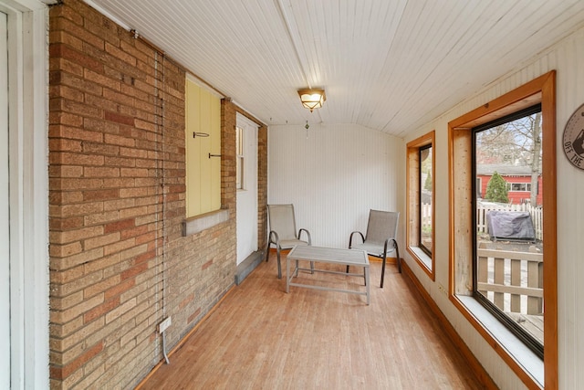 1739 Cedar Rd, Homewood, IL 60430 - living area featuring light wood-style flooring, brick wall, and wooden ceiling