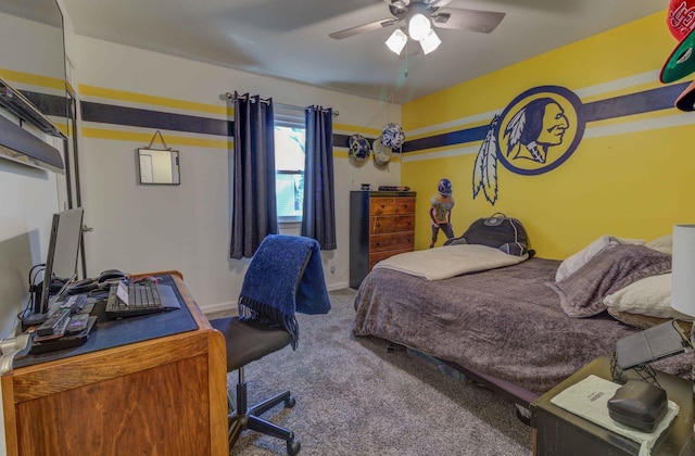 bedroom featuring ceiling fan and carpet