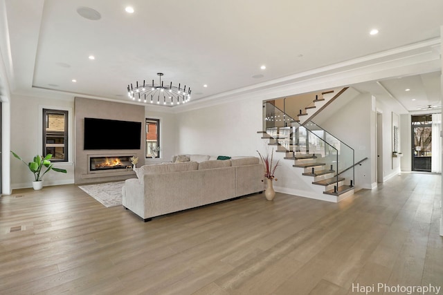 1906 Lee St, Des Plaines, IL 60018 - living room featuring a glass covered fireplace, plenty of natural light, recessed lighting, and stairs