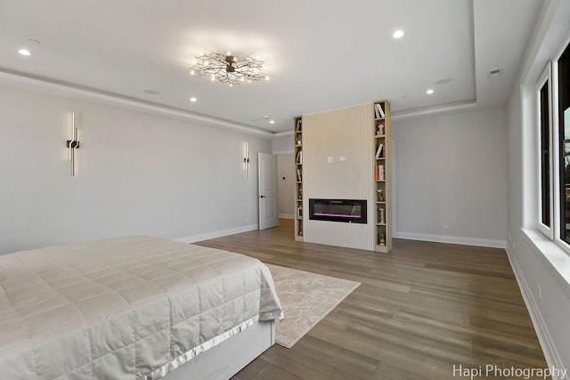 1906 Lee St, Des Plaines, IL 60018 - bedroom with recessed lighting, a glass covered fireplace, and baseboards