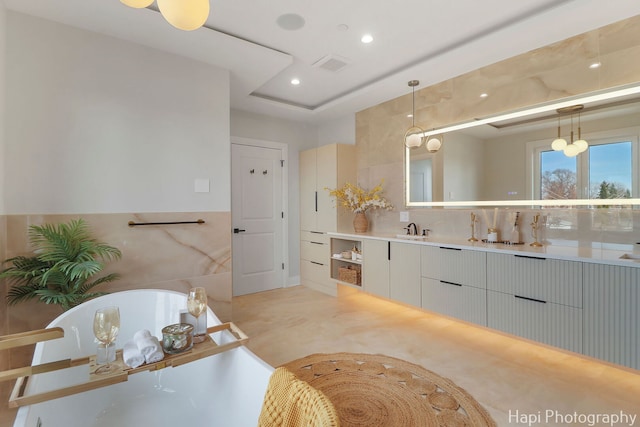 1906 Lee St, Des Plaines, IL 60018 - bathroom featuring visible vents, a freestanding tub, recessed lighting, and vanity