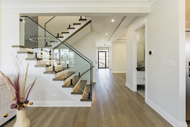 1906 Lee St, Des Plaines, IL 60018 - stairway with baseboards, recessed lighting, and wood finished floors