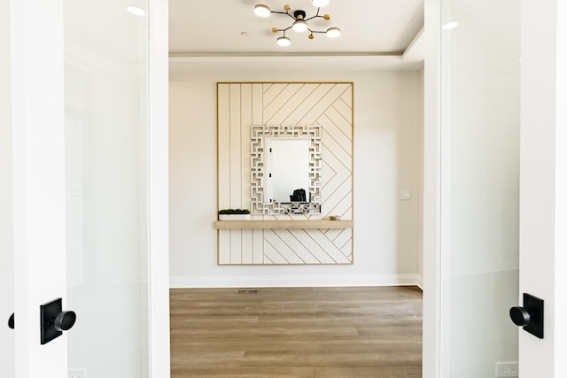 1906 Lee St, Des Plaines, IL 60018 - interior space with an inviting chandelier, wood finished floors, and baseboards
