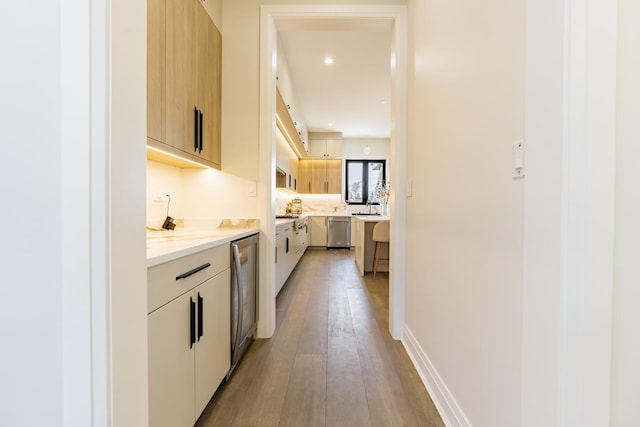1906 Lee St, Des Plaines, IL 60018 - interior space with stainless steel dishwasher, beverage cooler, modern cabinets, and light countertops