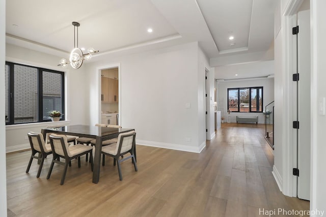 1906 Lee St, Des Plaines, IL 60018 - dining space with a tray ceiling, baseboards, recessed lighting, wood finished floors, and a notable chandelier