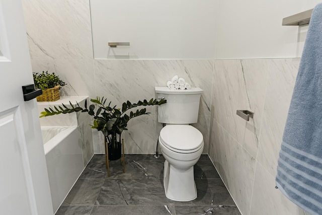 1906 Lee St, Des Plaines, IL 60018 - bathroom featuring toilet, marble finish floor, and tile walls