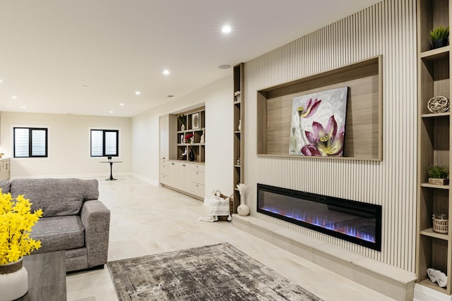 1906 Lee St, Des Plaines, IL 60018 - living area featuring baseboards, recessed lighting, built in shelves, and a glass covered fireplace