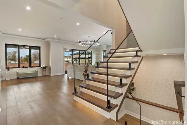 1906 Lee St, Des Plaines, IL 60018 - stairs featuring recessed lighting, wood finished floors, an inviting chandelier, and plenty of natural light