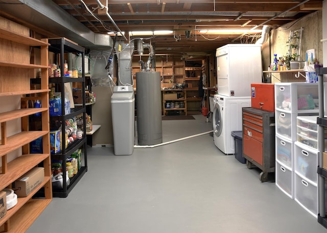 unfinished basement with stacked washer and dryer and gas water heater