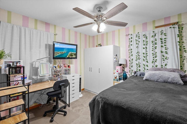 bedroom featuring ceiling fan, light carpet, and wallpapered walls