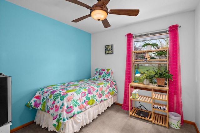 bedroom with carpet floors and baseboards