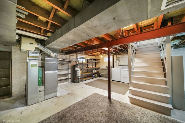 unfinished basement with separate washer and dryer, gas water heater, visible vents, stairs, and heating unit