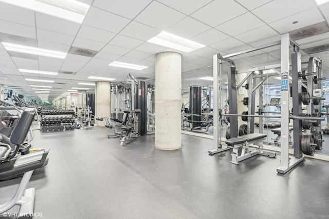workout area featuring a paneled ceiling